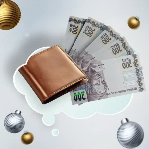 Carteira marrom com notas de dinheiro brasileiro em leque sobre nuvem de pensamento branca decorada com enfeites natalinos dourados e prateados